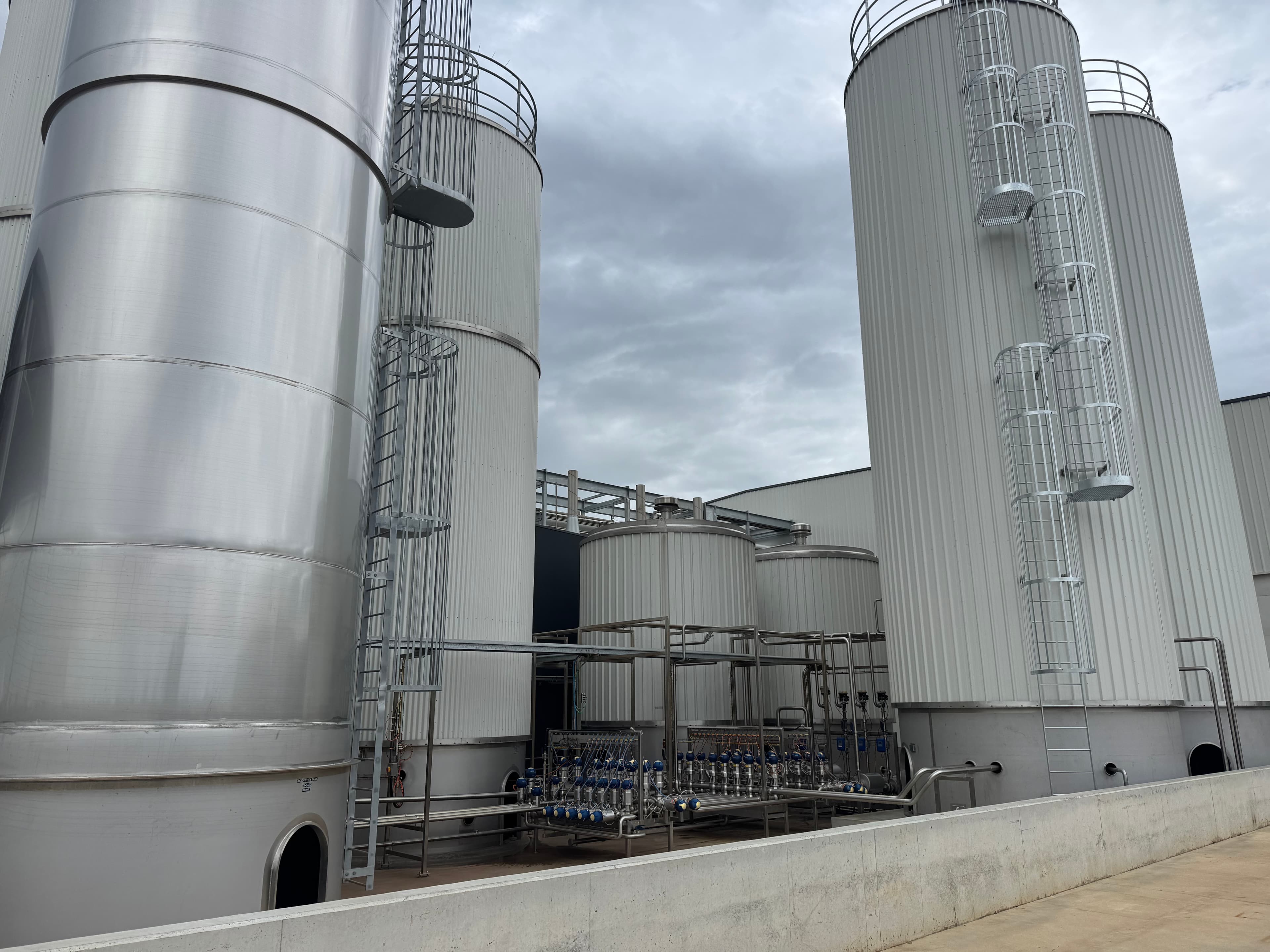 Food and beverage manufacturing facility with large stainless steel processing tanks